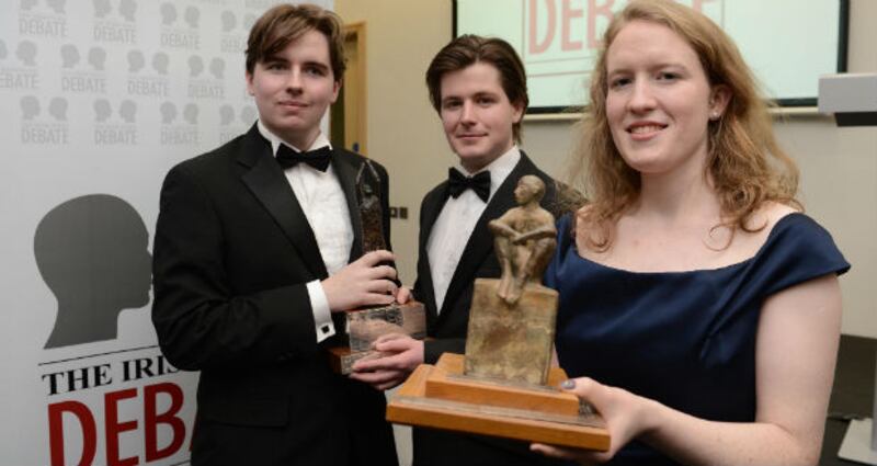 Irish Times debate winners Kate Brady (TCD Hist) with Liam Brophy and John Engle (right) from the TCD Bram Stoker club after this evenings 2013 Irish Times Debate Final held in Queens Universtiy's Riddel Hall. Photograph: Charles McQuillan/Pacemaker.