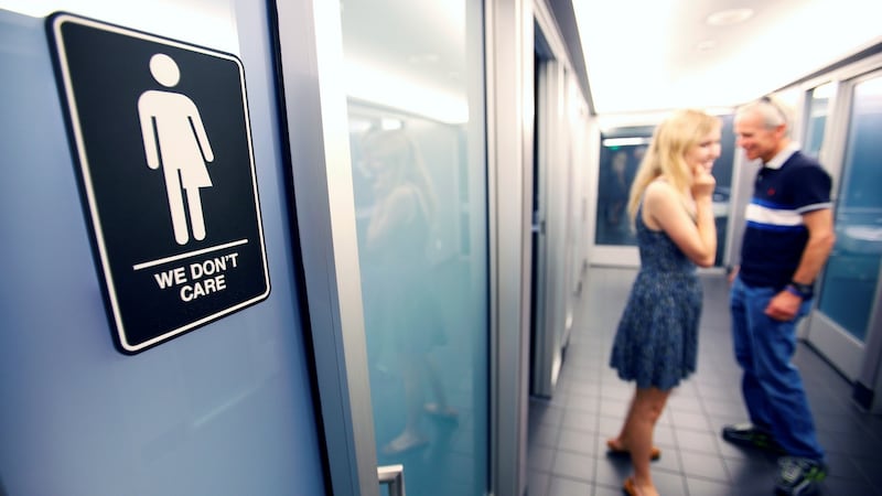 A sign protesting against a North Carolina law restricting transgender bathroom access on a bathroom cubicle at the 21C Museum Hotel in Durham, North Carolina, last May. Photograph: Jonathan Drake/Reuters