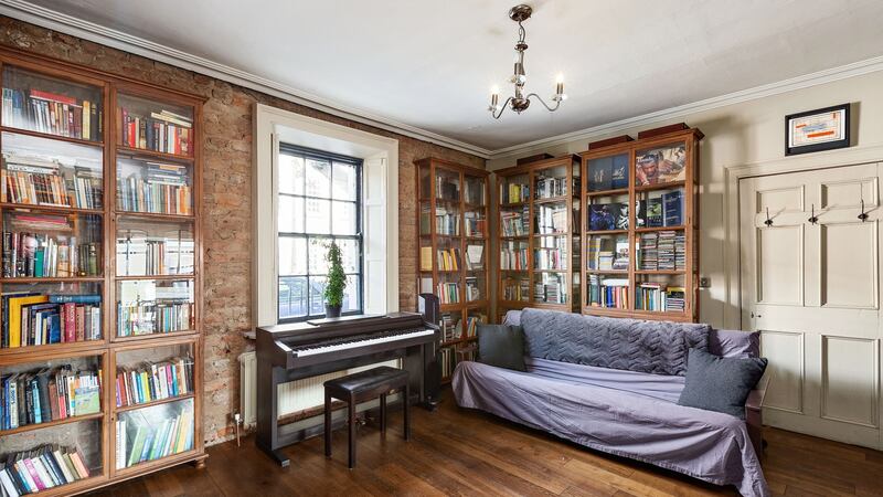 There are freestanding book and display units in both livingroom and diningroom