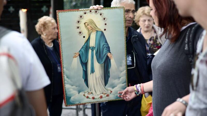 Looking at cures: pilgrims in Lourdes. Photograph: Remy Gabalda/AFP/Getty Images