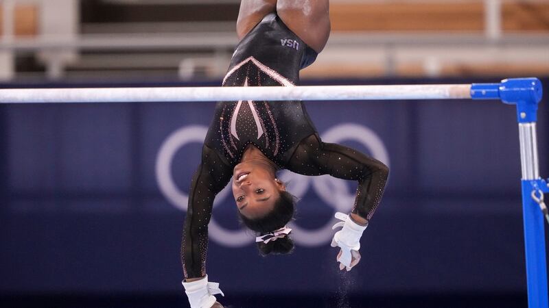 Simone Biles practices the uneven bars at Ariake Gymnastics Centre in Tokyo. Photo: Chang W. Lee/The New York Times