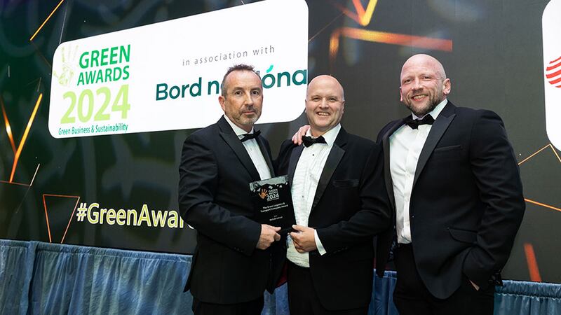 Paul Fitzpatrick, manager at ESB Smart Energy Services, presents the green logistics & transport company award award to Ashley McCulla and Gary Edwards, McCulla Ireland