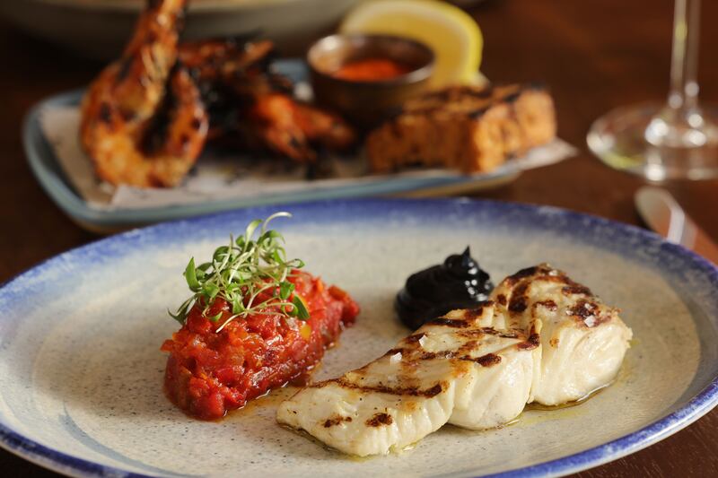 Grilled halibut steak with Basque peppers. Photograph: Alan Betson 