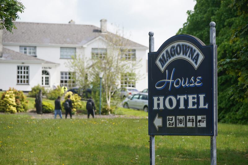 Asylum seekers leaving the grounds of the Magowna House hotel in Inch, Co Clare, last month, as protests were mounted nearby regarding their presence. Photograph: Niall Carson/PA Wire