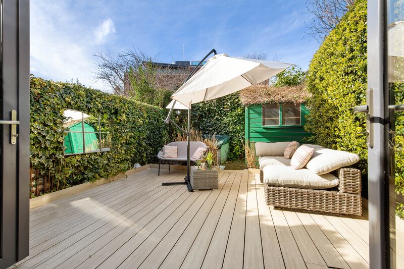 The rear garden of the property feeks like another room. 