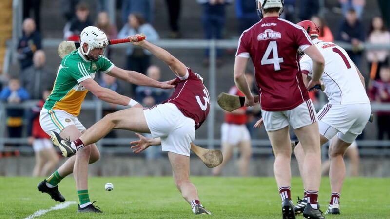 Offaly’s Oisin Kelly battles with Galway’s Daithi Burke. Photograph: Bryan Keane/Inpho