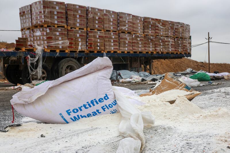 Humanitarian aid for Palestinians in Gaza lies scattered on the ground beside broken-down trucks near the border with the Gaza Strip, close to the Kissufim crossing in southern Israel, on Wednesday. Photograph: Jack Guez/AFP/Getty