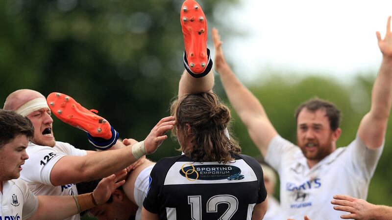 Cork Constitution’s Ross O’Neill is tackled by Sean Coughlan of Belvedere. Photograph: Donall Farmer/Inpho