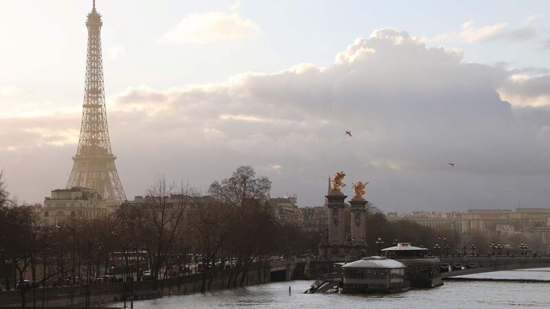 The  flooded banks of the river Seine are seen with the  Eiffel Tower in the backround in Paris.  Photograph: AFP