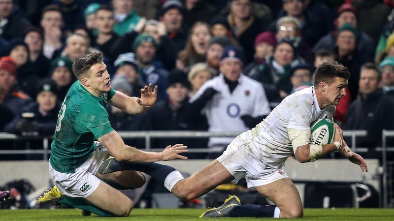 Garry Ringrose tries to stop Henry Slade scoring a try for England. Photo: Gary Carr/Inpho