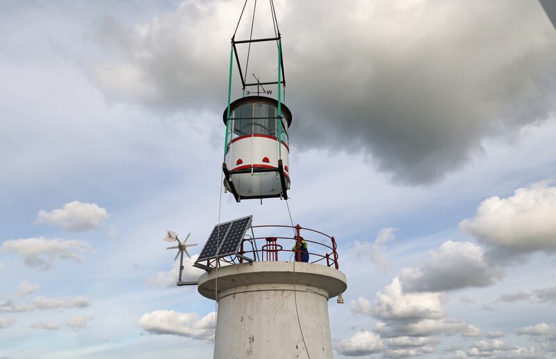 The dome is lowered on to the base on the East Pier. Photograph: Nick Bradshaw/The Irish Times