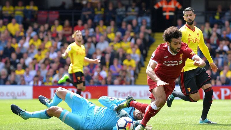 Heurelho Gomes brings down Mohamed  Salah for Liverpool’s equalising penalty at Vicarage Road. Photograph: Olly Greenwood/AFP
