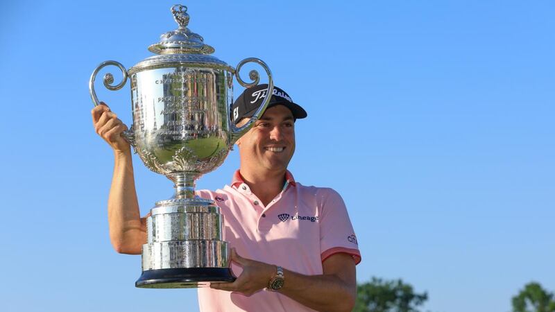 Justin Thomas poses with the Wanamaker Trophy. Photograph:  Sam Greenwood/Getty