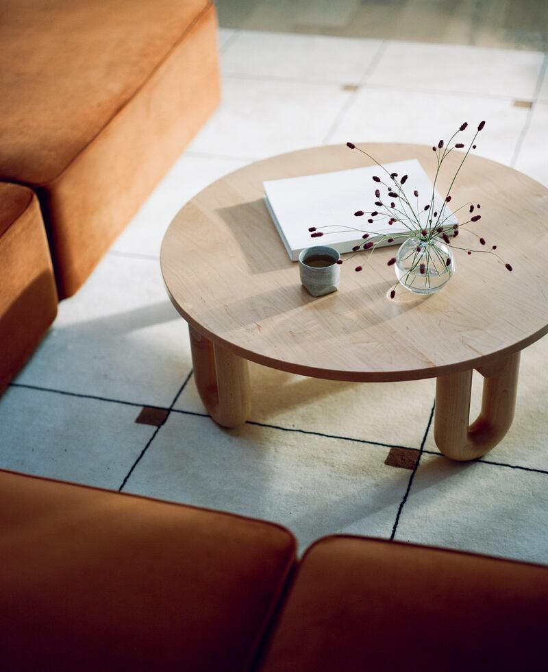 A coffee table in a living room space. Photograph: Tess Comrie/The New York Times