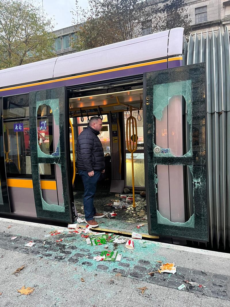 Dublin Lord Mayor Councillor Daithí de Róiste inspects the damage to the Luas tram on Dublin's O'Connell Street on Friday morning. Photograph: Conor Pope 