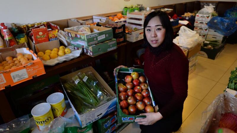 Chinese flavour: Wei Zhong at Qing’s vegetable shop, one of the many Asian stores around Parnell Street East in Dublin. Photograph: Brenda Fitzsimons