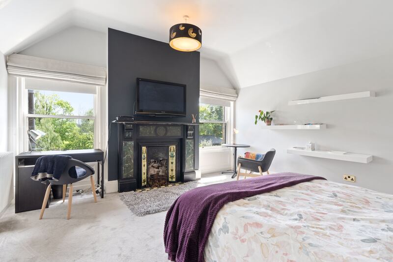 Bedroom on first floor with fireplace