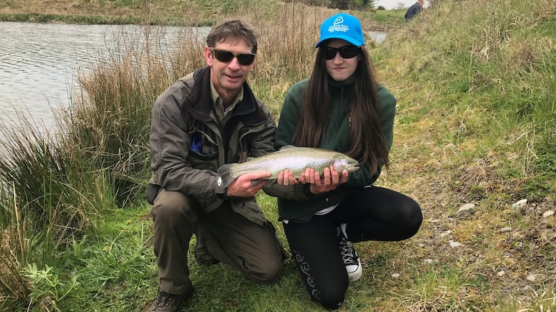 Nicola Devereux (16) with a trout from the K Club lakes, ably assisted by IFI assistant inspector Des Chew