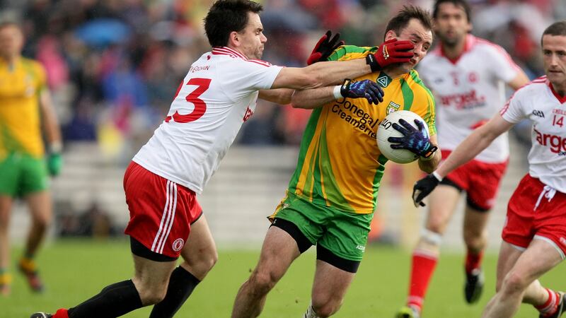 Tyrone’s Ryan McMenamin and Karl Lacey of Donegal during the Ulster semi-final in 2012. Photo: Cathal Noonan/Inpho