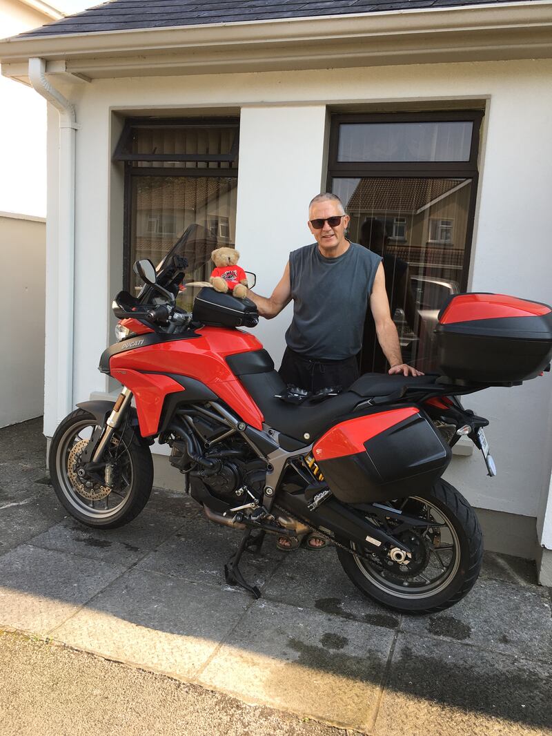 Tomás Ó Dúlaing and La Duchessa, as his Ducati is known, outside his mother's home in Castleisland, Co Kerry