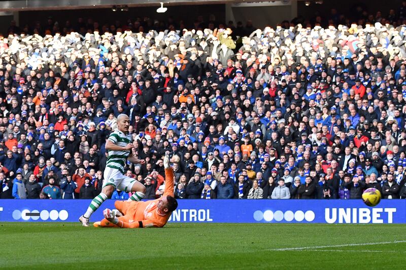 Daizen Maeda scores Celtic's first goal at Ibrox. Photo: Mark Runnacles/Getty Images