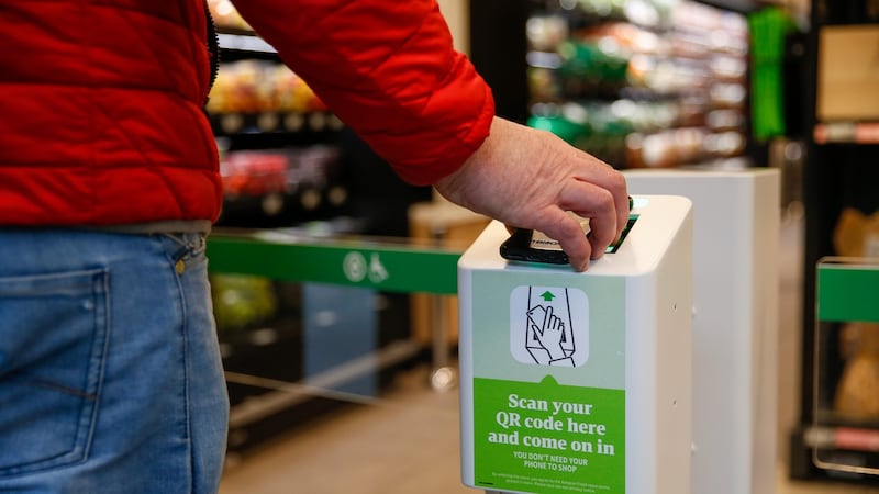 A shopper scans their phone to enter the  Amazon Fresh store. Their credit card will be charged when they exit.  Photograph: Bloomberg