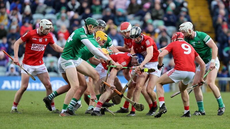 Cork and Limerick players compete for possession during the game. Photograph: Bryan Keane/Inpho