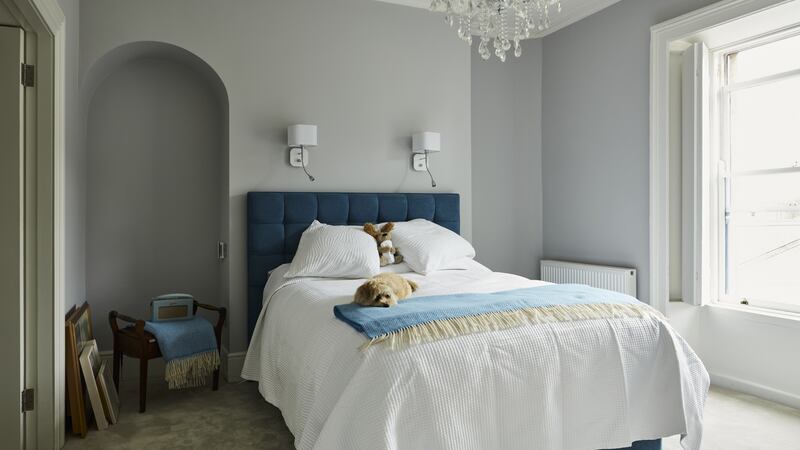 Main bedroom - the chandelier was not chosen by Ledwith but she is enjoying it for now. Photograph: Philip Lauterbach