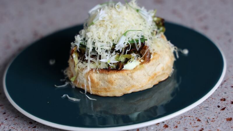 Hegarty’s cheddar crumpet arrives in a cloud of micro-planed cheese. Photograph: Nick Bradshaw