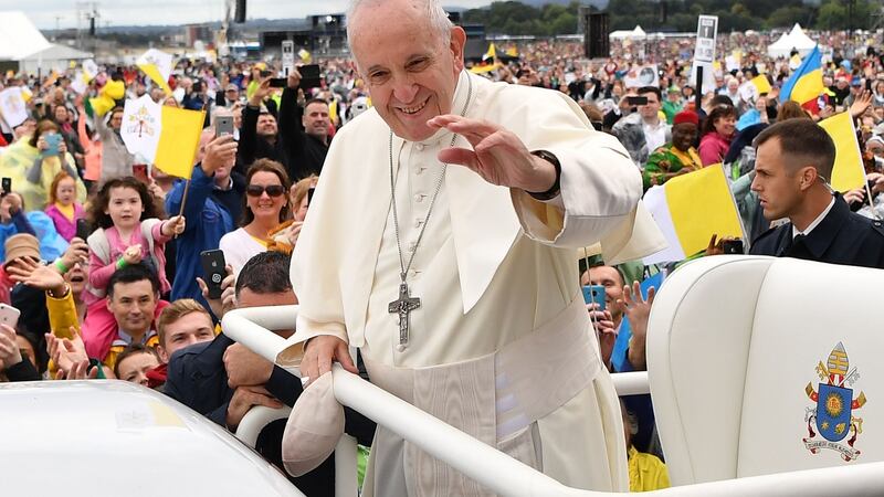 Pope Francis waves to the faithful as he arrives to lead the Holy Mass at Phoenix Park on Sunday.  Photograph: Ben Stansall/AFP/Getty Images