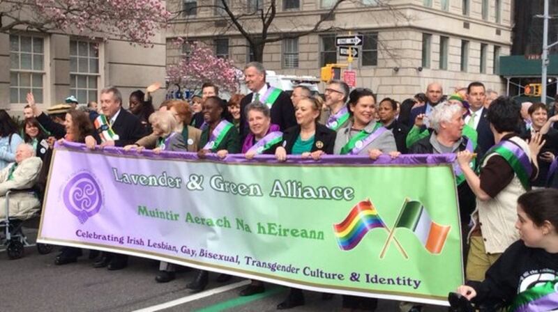 Sinn Féin’s Mary Lou McDonald helps hold the banner of the Lavender & Green LGBT Alliance at New York’s St Patrick’s Day parade as it participates in the event for the first time. Photograph: Simon Carswell/The Irish Times