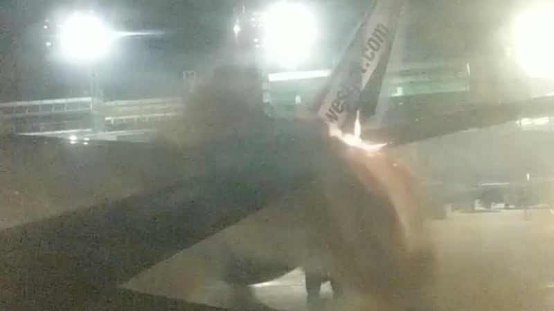 An explosion is seen through a window of a plane that collided with another plane at Toronto’s Pearson Airport, Canada. Photograph: Stephen Belford/Reuters