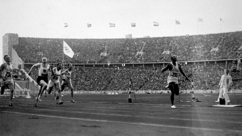 Owens crosses the finishing line to win the 100 metres in 1936. Photo: Keystone/Getty Images