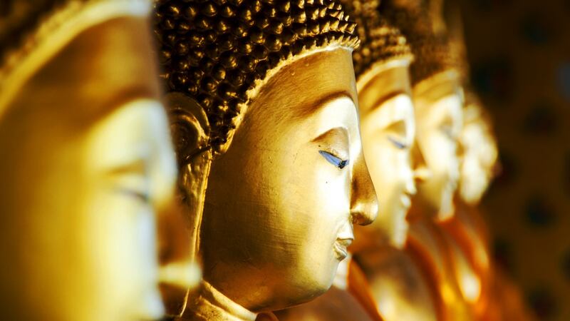 Row of Buddhas at Wat Arun, Bangkok, Thailand.