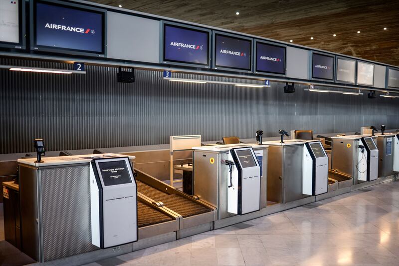 Empty check-in desks inside Roissy-Charles de Gaulle Airport during a French air traffic controllers' strike. Photograph: EPA