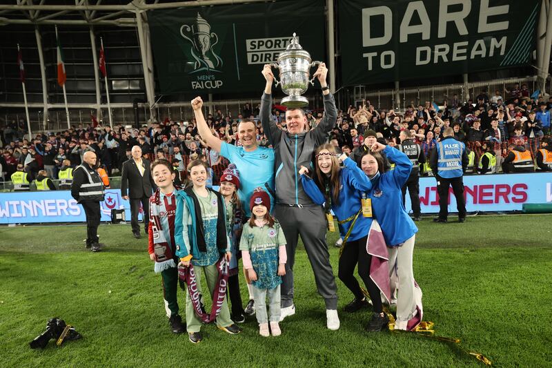 Drogheda United manager Kevin Doherty and assistant manager Daire Doyle celebrate with their families after the FAI Cup final. Photograph: Bryan Keane/Inpho