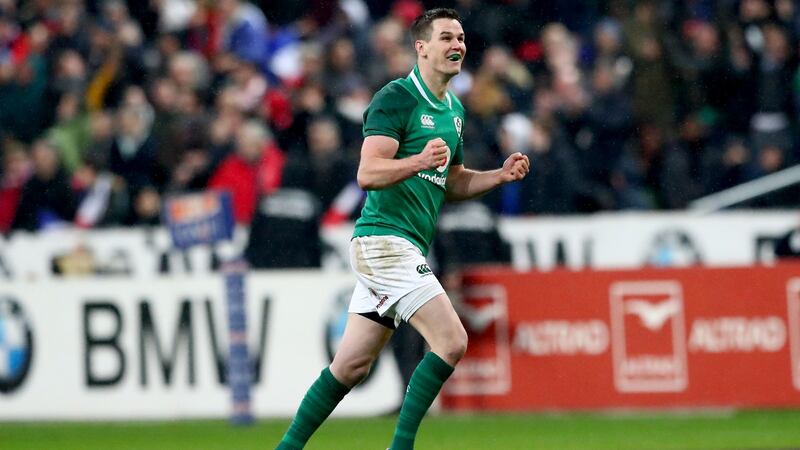 Ireland’s Johnny Sexton – wearing the boots that sold for €15,500 – celebrates kicking the winning drop goal against France. Photograph: James Crombie/Inpho