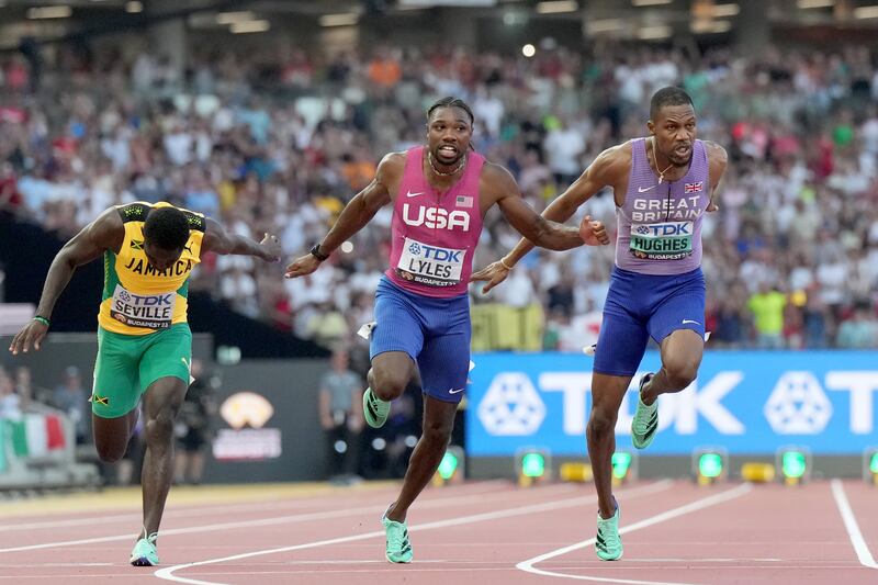 Great Britain's Zharnel Hughes (right) taking bronze alongside USA's Noah Lyles (centre) who took gold in the men's 100m final on day two of the World Athletics Championships at the National Athletics Centre, Budapest, Hungary. Photograph: Martin Rickett/PA Wire