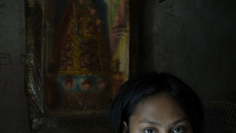 Zia (19) poses for a portrait inside her home in Manila. She had a backdoor abortion when she was 14. She went to a hospital after 2 weeks of profuse bleeding. Photograph: Kimberly dela Cruz