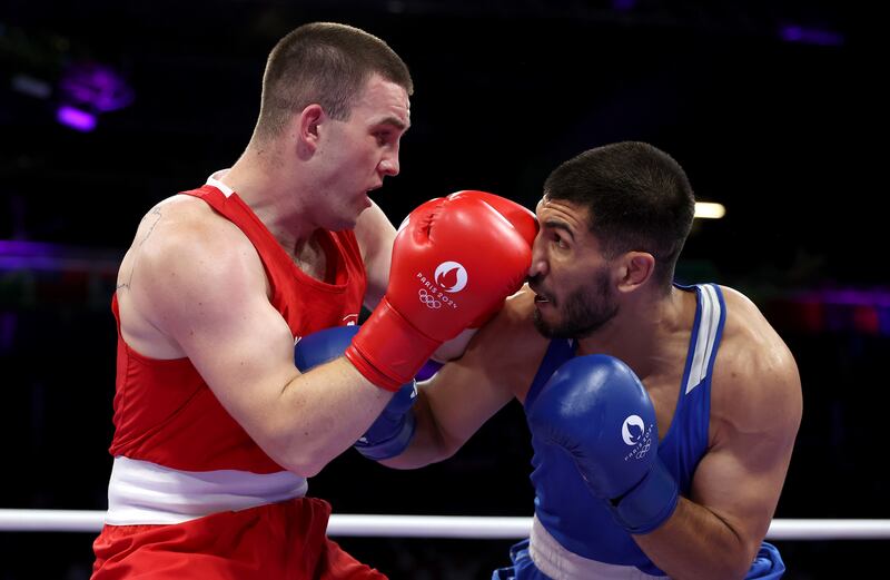 Ireland's Jack Marley punches Davlat Boltaev of Tajikistan during their heavyweight quarter-final match. Photograph: Richard Pelham/Getty Images