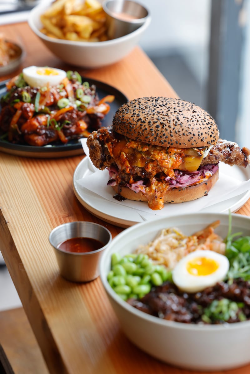 TTeokbokki, roasted rice cake, gochujang pork, scallions, egg, Seoul burger, and beef bulgogi, with soy, apple and garlic marinade. Photograph: Alan Betson 

