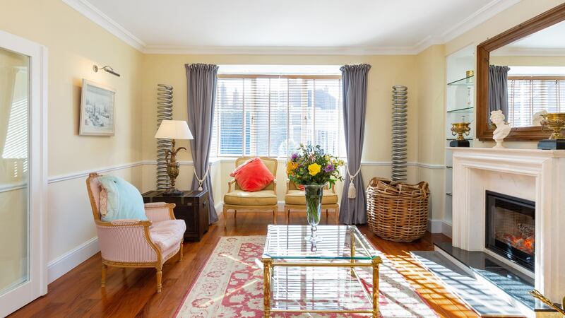 Living room with inset stove.