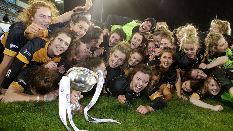 Mourneabbey’s players celebrate with the trophy. Photo: Laszlo Geczo/Inpho
