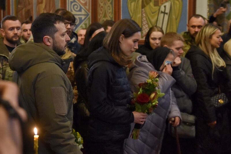 Ukrainian president Volodymyr Zelenskiy and Finland's prime minister Sanna Marin at the funeral of Ukrainian serviceman Dmytro Kotsiubailo in Kyiv. Commander  Kotsiubailo was killed in action on the frontline in Bakhmut, eastern Ukraine. Photograph: Oleg Petrasyuk