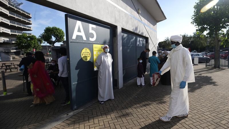 A worshipper in PPE arrives at Croke Park, Dublin, on the first day of Eid. Photograph: Damien Eagers/PA Wire