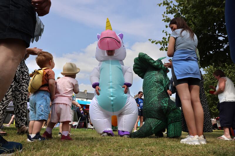 Children meet and greet unicorns and dinosaurs in the Scarecrow Village. Photograph: Dara Mac Dónaill