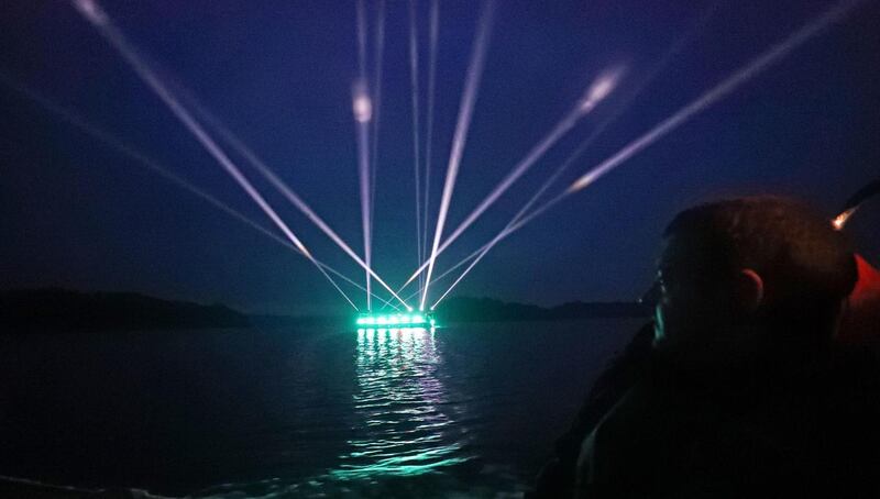 Lighting designer Matthew McCloskey watches from a rib as The Light Ballet light installation begins its eight-day journey along the River Shannon at Lough Key in Boyle, Co Roscommon on Monday. Photograph: Niall Carson/PA Wire