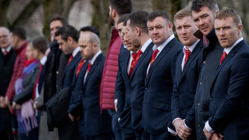 Players Dave Kilcoyne, John Ryan, Peter O’Mahony and Keith Earls form a guard of honour outside the church for Garrett Fitzgerald. Photograph: Ryan Byrne/Inpho