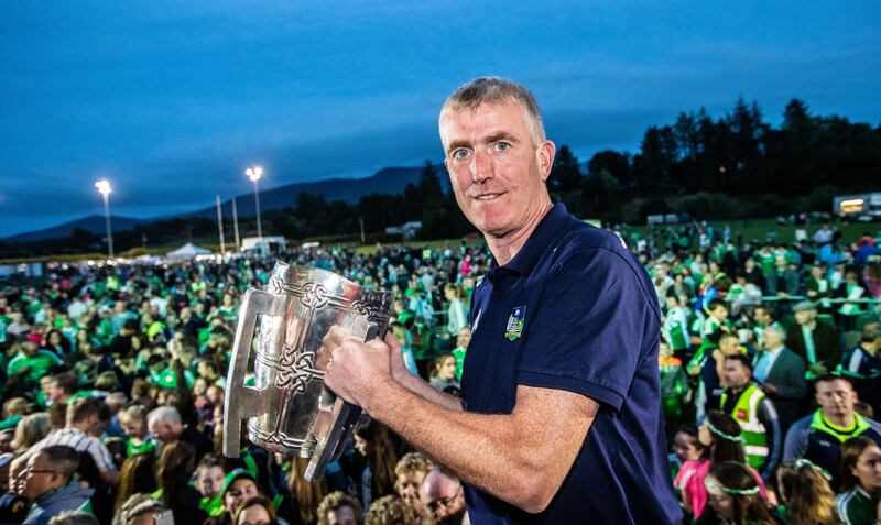Limerick manager John Kiely brings the Liam MacCarthy cup back to his home town of Galbally after his team's All-Ireland first win in 2018. Photograph: James Crombie/Inpho 