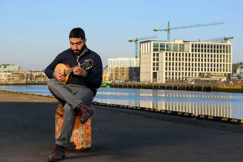Sarraj Alserawi has added the mandolin to his repertoire since moving to Ireland. Photograph: Daragh McSweeney/Provision